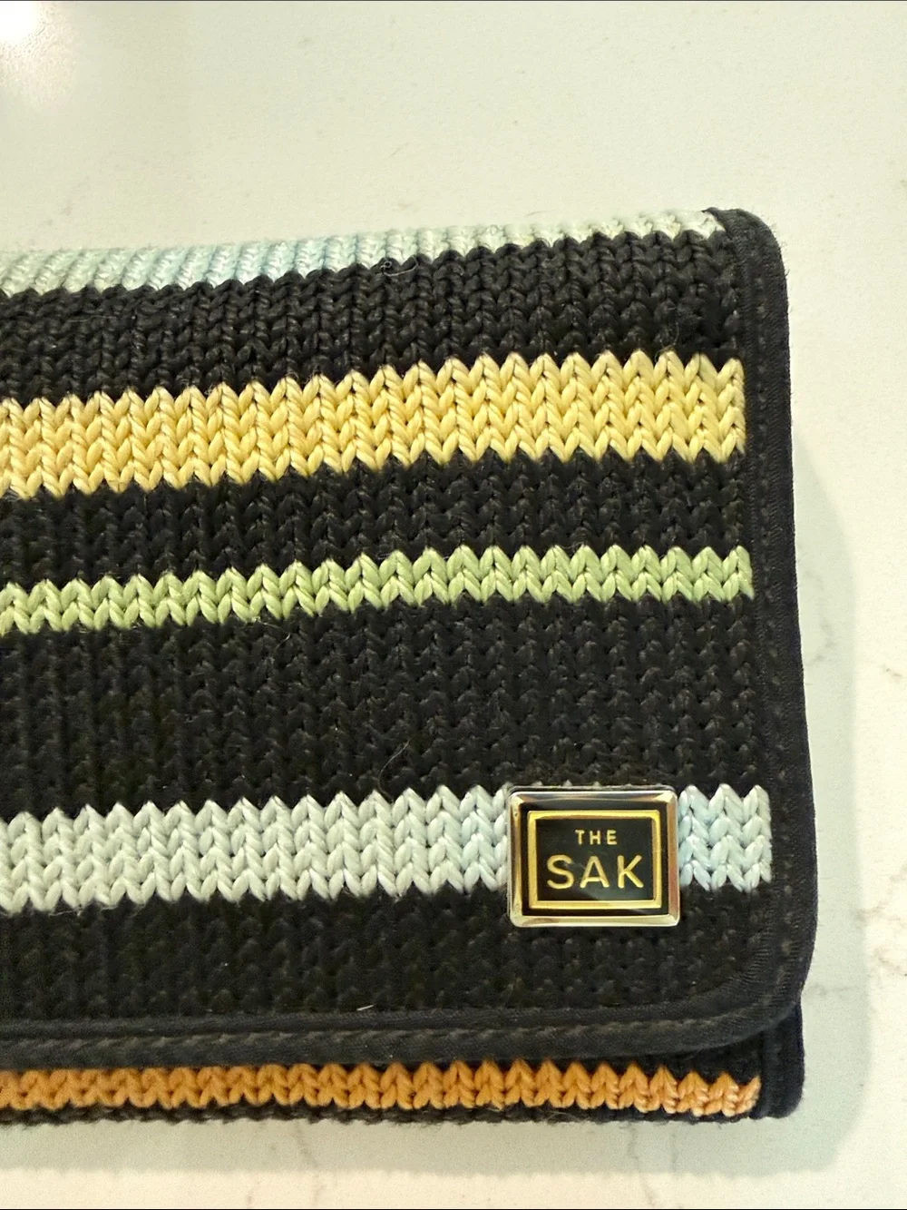 The Sak Black Wristlet Clutch with Mutlicolor Stripes